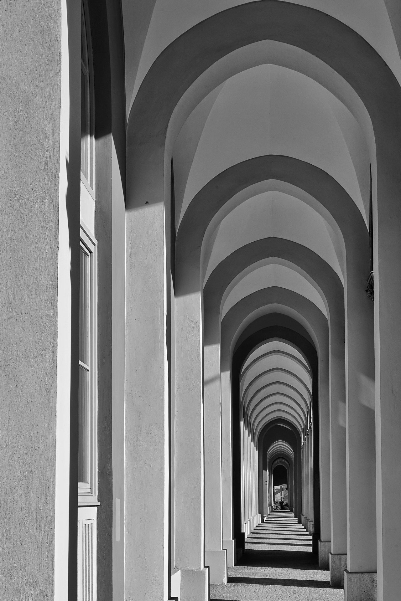 A long corridor of stone arches